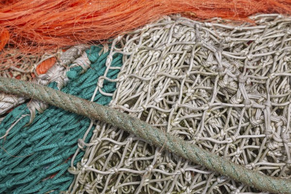 Complex structure of brightly coloured fishing nets and ropes in vivid colours, Greetsiel, East Frisia, Lower Saxony, Germany