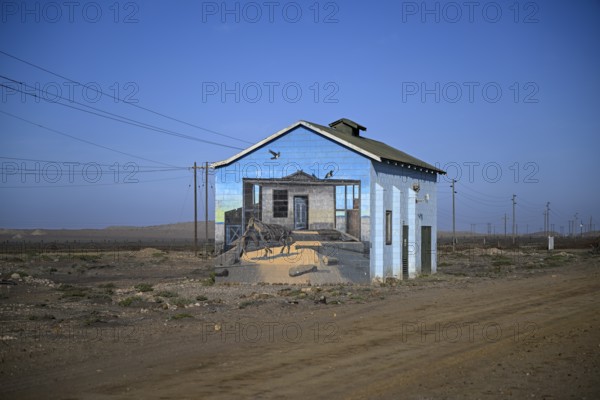 Painted house facade, graffito, brown hyena, diamonds, Oranjemund, Karas region, Namibia