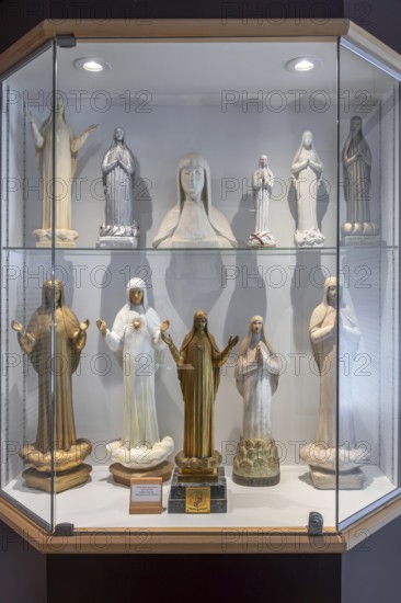 Religious statuettes in museum near Our Lady of Beauraing, Notre-Dame de Beauraing sanctuary, place of pilgrimage at Beauraing, Namur, Belgium