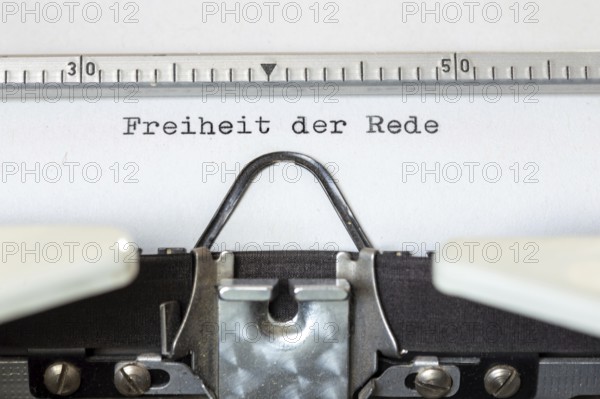 FREEDOM OF SPEECH, written with a typewriter