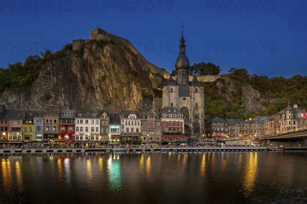 Citadel and 13th-century Collegiate Church of Notre Dame de Dinant in the city along the river Meuse at dusk, province of Namur, Wallonia, Belgium