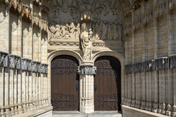 Portal of 14th century Onze-Lieve-Vrouw-ten-Poelkerk, Gothic church of Our Lady ten Poel in the city Tienen, Tirlemont, Flemish Brabant, Belgium
