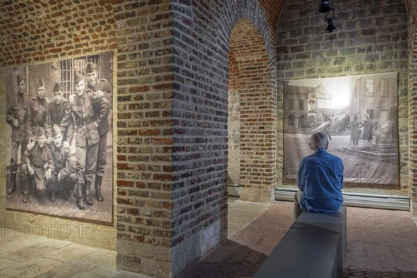 Vintage photos of WWII in Het Toreke museum, former 19th century prison at the Grote Markt in the city Tienen, Tirlemont, Flemish Brabant, Belgium. Model released