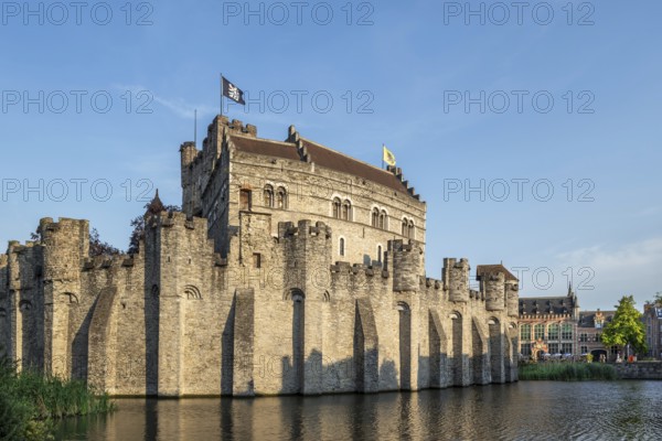 12th century medieval moated Gravensteen, castle of the counts in the historic city centre of Ghent in summer, East Flanders, Belgium