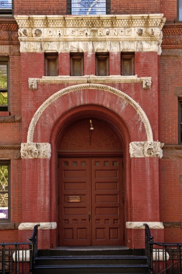 Historic school building with separate entrance for girls, New York City, USA
