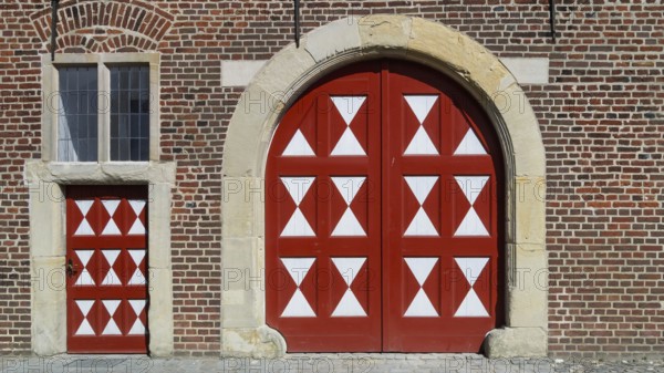 Historic moated castle, Renaissance Raesfeld Castle, façade with one Tor tor and one door, Freiheit Raesfeld, Münsterland, North Rhine-Westphalia, Germany