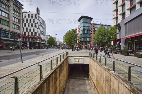 Rotebühlplatz underground station, city centre, street, general architecture, stainless steel railings, square, pedestrians as accessories, milky blue sky, diffuse light, intersection Rotebühlplatz, Königstraße and Marienstraße, Stuttgart, state capital, city district Stuttgart, Baden-Württemberg, Germany