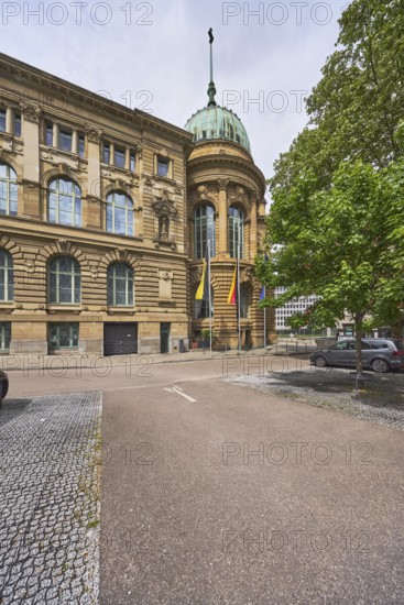 Haus der Wirtschaft Baden-Württemberg, conference centre, congress centre, flagpoles, flags, building, historic house, architect Frederik Skjøld Neckelmann, trees, car park, milky blue sky, diffuse light, slightly sunny, Willi-Bleicher-Straße, Stuttgart, state capital, urban district of Stuttgart, Baden-Württemberg, Germany
