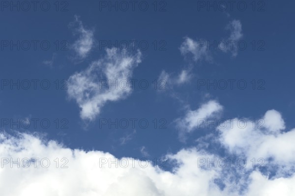 Above feather clouds veil clouds fibrous cirrus clouds torn cirrus clouds, below cirrocumulus clouds and upper edge of altostratus cloud under blue sky, international