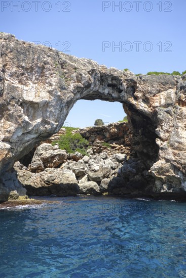 Natural rock arch at Cala Varques on the east coast of the Mediterranean island of Majorca between Porto Cristo Portocristo and Portocolom, Majorca, Balearic Islands, Spain