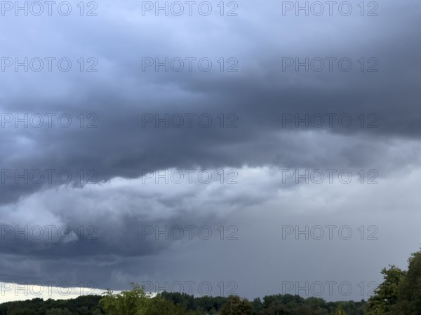 Gathering low pressure area with rain front dark stratus clouds Nimbostratus clouds over forest area, international