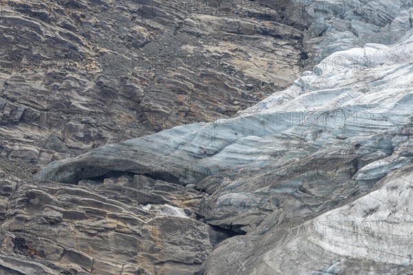 Majestic ice formations dominate the rocky terrain and show the beauty of a glacier in a secluded mountain location in daylight. The inseparable textures emphasise the artistry of nature. Gorner Glacier, Zermatt, Valais, Alps, Swiss