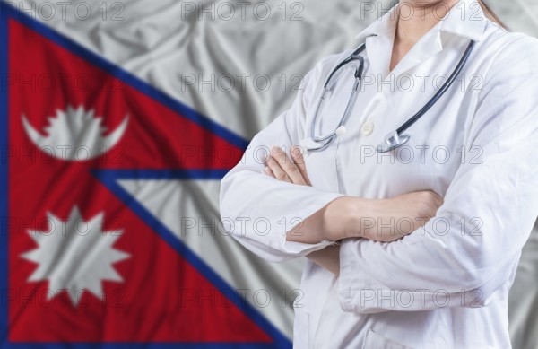Doctor with crossed arms on Nepal flag. Nepali health and care concept. Female doctor on Nepal flag