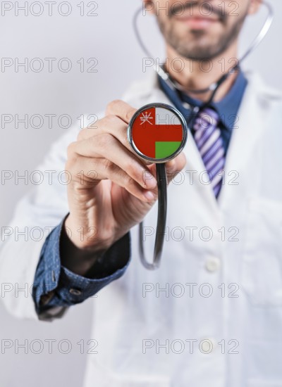 Oman health and medical insurance concept. Oman healthcare system, doctor holding stethoscope