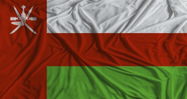 Omani flag with fabric texture background. National flag of Oman with cloth texture