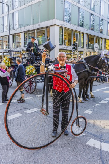 A penny-farthing rider with top hat, Oktoberfest, Munich, Upper Bavaria, Bavaria, Germany