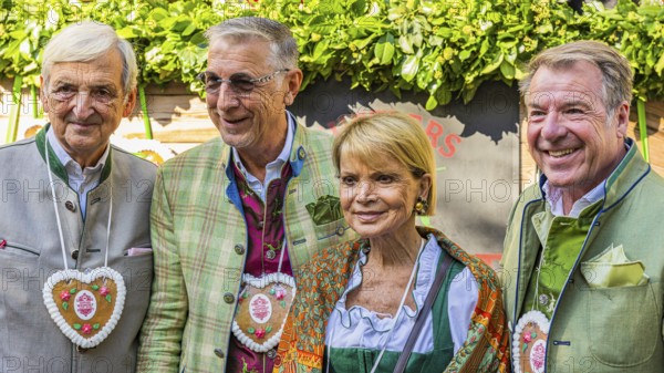 The actress Uschi Glas with her man Dieter Hermann, the folk musician Patrick Lindner with his man Peter shepherd, Oktoberfest, Munich, Upper Bavaria, Bavaria, Germany