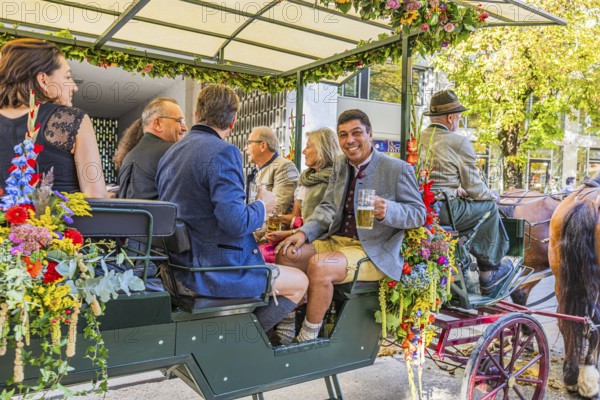 Former FC Bayern footballer Giovanne Elfer in a horse-drawn carriage, Oktoberfest, Munich, Upper Bavaria, Bavaria, Germany