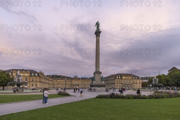 Evening atmosphere at Schlossplatz Stuttgart. View of the New Palace and Jubilee Column. Stuttgart, Baden-Württemberg, Germany