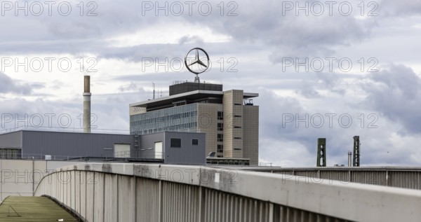 The Mercedes star rotates on a Mercedes Benz Group building in Untertürkheim. Stuttgart, Baden-Württemberg, Germany