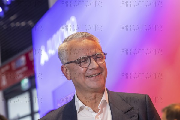 Philipp von Hirschheydt, CEO Aumovio. Exhibition stand of the company Aumovio. IAA MOBILITY in Munich. The motor show presents itself as a holistic mobility trade fair. Cars continue to take centre stage, however, and Chinese manufacturers are gaining ground. Munich, Bavaria, Germany