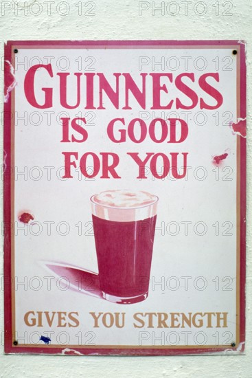 Old metal sign for Guinness beer, London, England, Great Britain