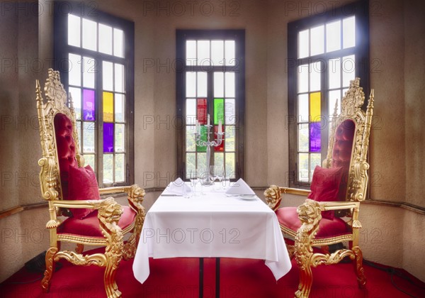 Interior view, table for 2 persons in corner tower, baroque interior, restaurant, Schloss Laufen, with view of the Rhine Falls Schaffhausen, waterfall, Laufen-Uhwiesen, Canton Schaffhausen, Switzerland