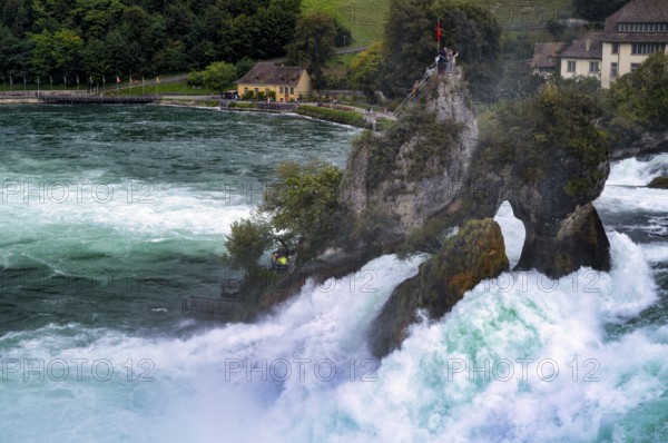 Tourists, visitors, on viewing platform, rock, middle rock, Rhine Falls Schaffhausen, waterfall, Canton Schaffhausen, Switzerland