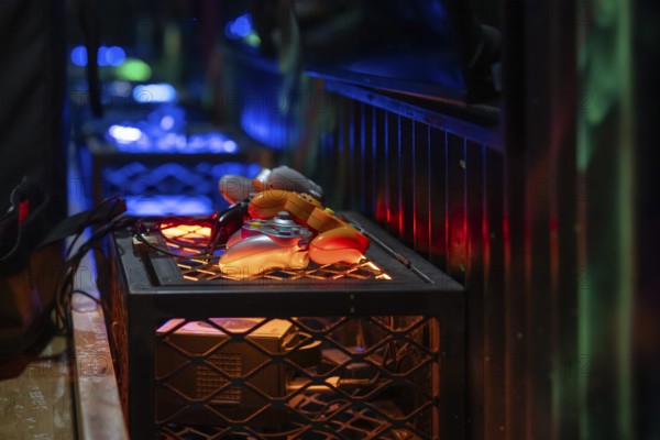 Orange-coloured gaming controllers, futuristic and tech-savvy atmosphere, arcade, Soho, London, England, United Kingdom