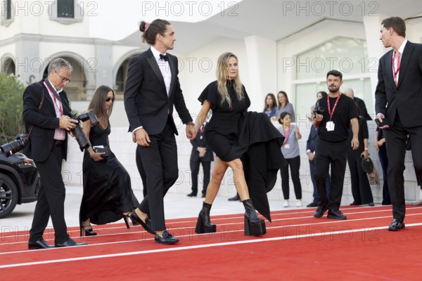 Venice, Italy - 2 September 2025: Rory St. Clair Gainer, Rebecca Ferguson during the Red Carpet of - A house of Dynamite - during the 82nd Venice International Film Festival