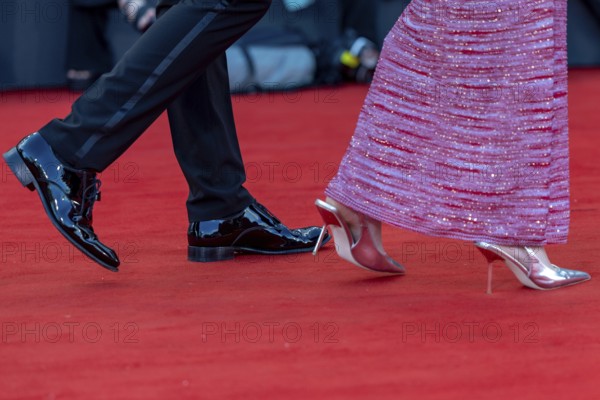 Venice, Italy - 2 September 2025: Tuxedo trousers, dinner jacket shoes and high heels during the red carpet of - A house of Dynamite - during the 82nd Venice International Film Festival