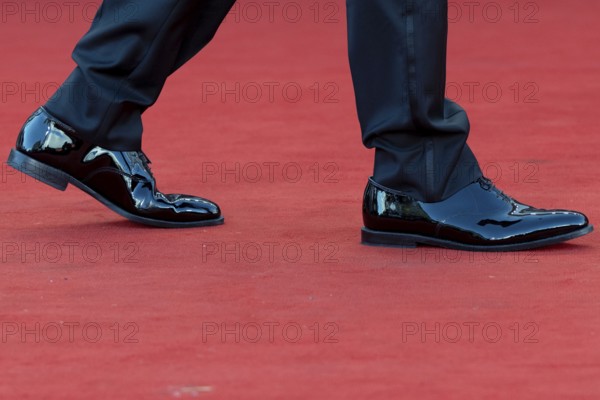 Venice, Italy - 2 September 2025: Tuxedo trousers and dinner jacket shoes during the red carpet of - A house of Dynamite - during the 82nd Venice International Film Festival