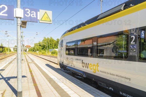 Modern train at a sunny railway station with blue sky and trees in the background, battery Electric train with green electricity, Siemens Mireo Plus B, Freudenstadt, Germany