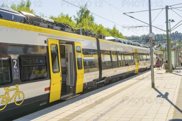Modern yellow train on the platform on a sunny day, battery Electric train with green electricity, Siemens Mireo Plus B, Freudenstadt, Germany