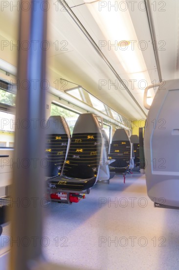 Bright train interior with several rows of seats, battery Electric train with green electricity, Siemens Mireo Plus B, Freudenstadt, Germany