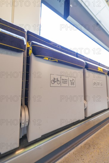 Train interior with folding seats and bright lights, battery Electric train with green electricity, Siemens Mireo Plus B, Freudenstadt, Germany