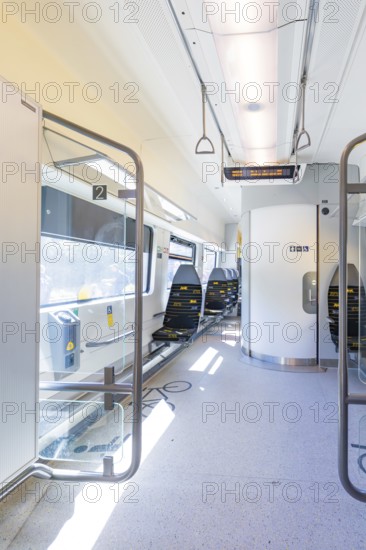 Modern and bright train interior with empty seats and lighting, battery Electric train with green electricity, Siemens Mireo Plus B, Freudenstadt, Germany