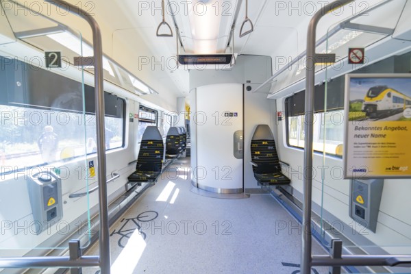 Interior of a modern train with blue seats and bright ambience, battery Electric train with green electricity, Siemens Mireo Plus B, Freudenstadt, Germany