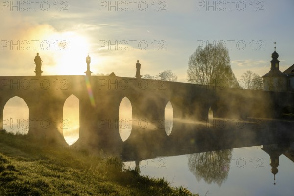 Morning atmosphere, fog at Fischhof, with historic Fischhof bridge, Tirschenreuth, Upper Palatinate, Bavaria, Germany