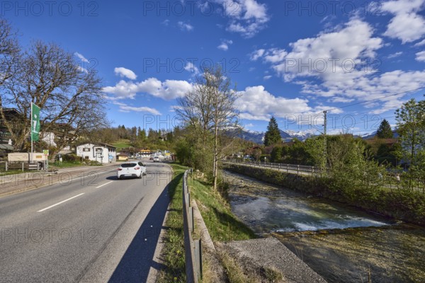 River Bischofswieser Ache, road, trees, hill, crash barrier, shadow, blue sky, cumulus clouds, federal road 20, main road, Bischofswiesen, district Berchtesgadener Land, Bavaria, Germany