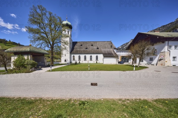 Parish church Herz-Jesu Bischofswiesen, vocational school for child care, meadow, hills, trees, buildings, blue sky, cirrostratus clouds, town hall square, Bischofswiesen, district Berchtesgadener Land, Bavaria, Germany