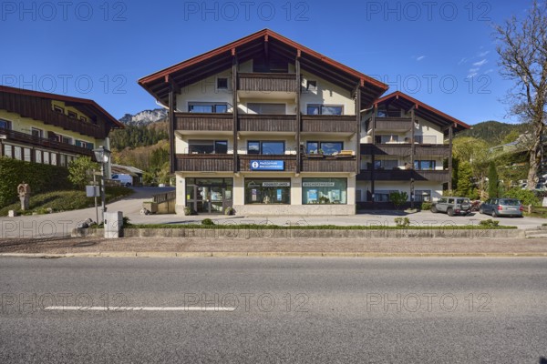 Tourist information, house, building, car park, tree, hill, coniferous forest, blue sky, federal road 20, main road, Bischofswiesen, district Berchtesgadener Land, Bavaria, Germany