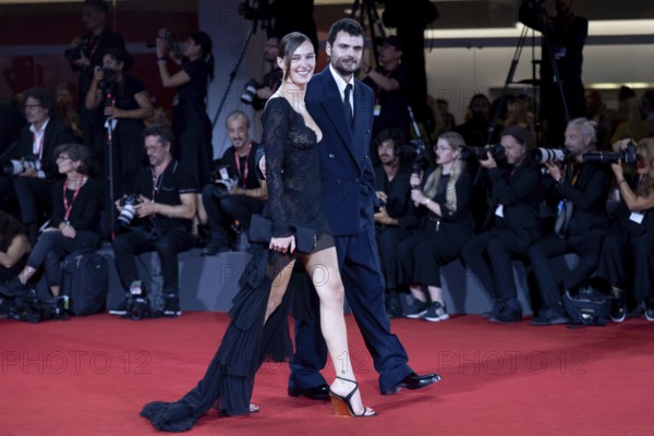 Venice, Italy - 3 September 2025: Devon Lee Carlson, Duke Nicholson during the Red Carpet of - Cartier Glory To The Filmmaker Award 2025 and In the Hand of Dante - during the 82nd Venice International Film Festival