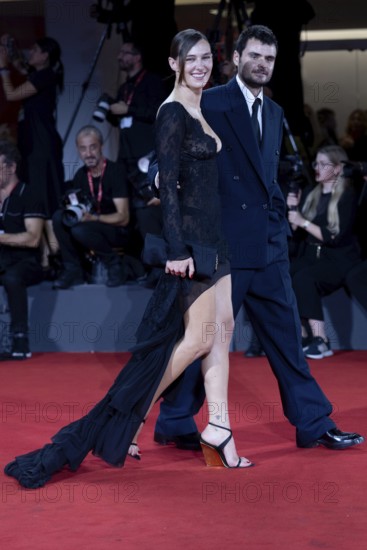 Venice, Italy - 3 September 2025: Devon Lee Carlson, Duke Nicholson during the Red Carpet of - Cartier Glory To The Filmmaker Award 2025 and In the Hand of Dante - during the 82nd Venice International Film Festival