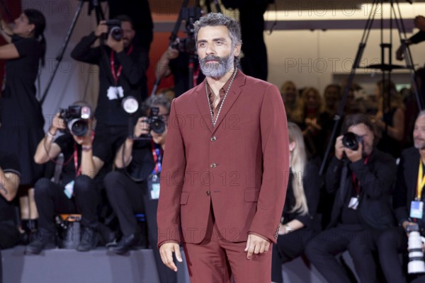 Venice, Italy - 3 September 2025: Oscar Isaac during the Red Carpet of - Cartier Glory To The Filmmaker Award 2025 and In the Hand of Dante - during the 82nd Venice International Film Festival