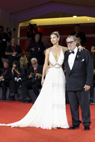 Venice, Italy - 3 September 2025: Louise Kugelberg and Julian Schnabel during the Red Carpet of - Cartier Glory To The Filmmaker Award 2025 and In the Hand of Dante - during the 82nd Venice International Film Festival