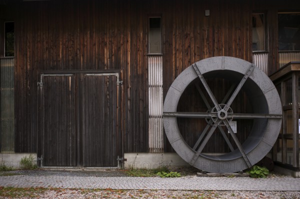 Historic wheel for processing grain, organic farm, Burgrain adventure farm near Willisau, Agrovision Burgrain AG, Canton of Lucerne, Switzerland