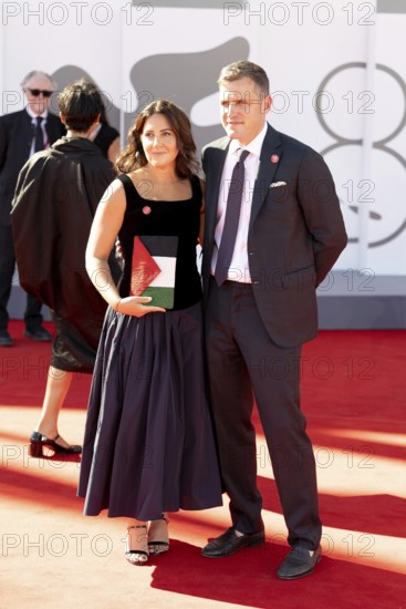 Venice, Italy - 3 September 2025: A guest carries a handbag designed in the colours of the Palestinian flag during the red carpet of - The Voice Of Hind Rajab - during the 82nd Venice International Film Festival