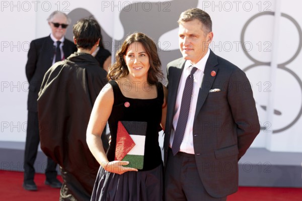 Venice, Italy - 3 September 2025: A guest carries a handbag designed in the colours of the Palestinian flag during the red carpet of - The Voice Of Hind Rajab - during the 82nd Venice International Film Festival