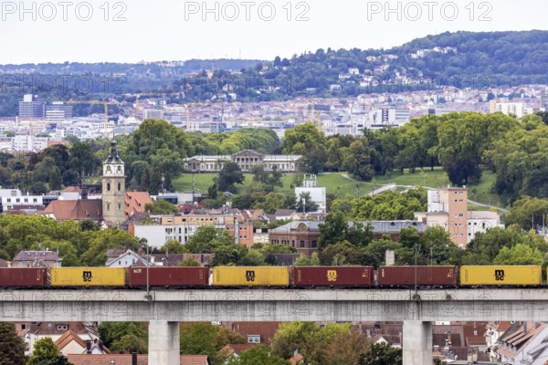 Goods train on the Schusterbahn, Münster railway viaduct with Bad Cannstatt and Rosensteinpark, Rosenstein Castle. Stuttgart, Baden-Württemberg, Germany